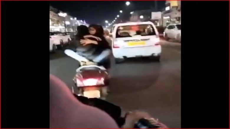 Lucknow-police-searching-for-couple-after-video-of-them-romancing-on-scooty-goes-viral